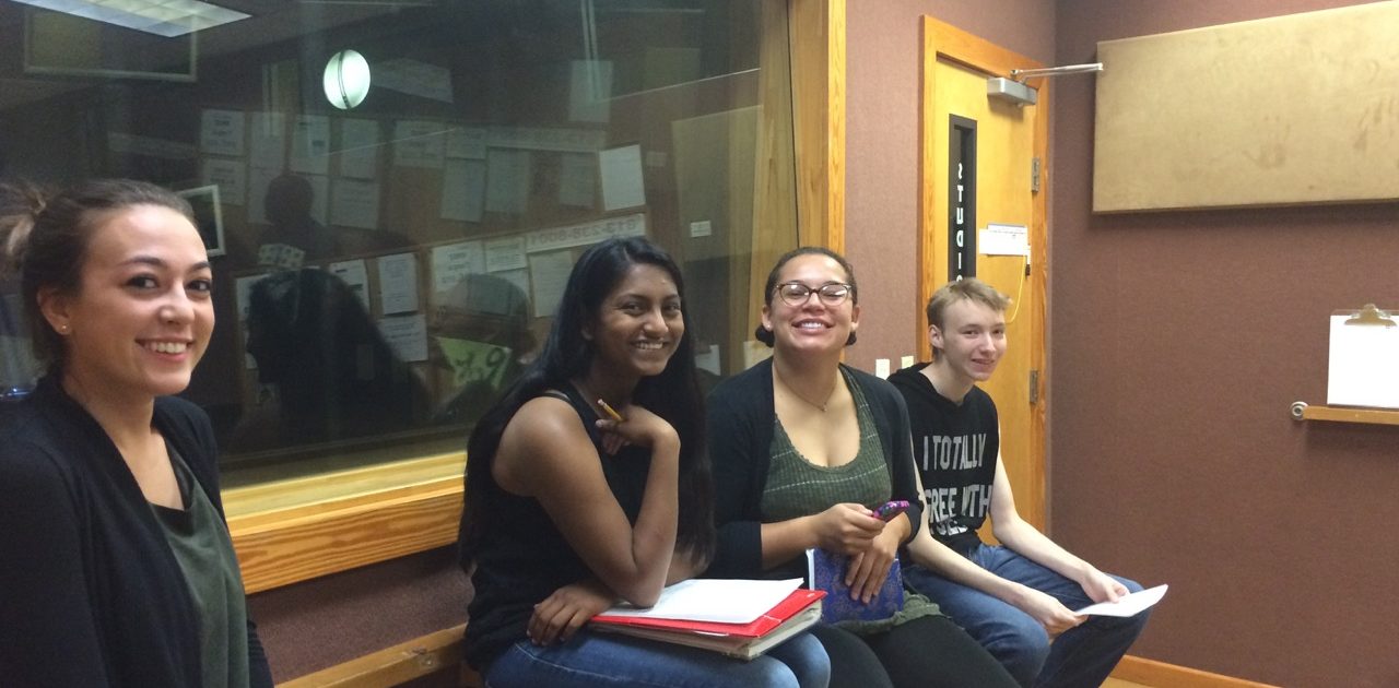 Four poetry club members perform on "Poetry Is..." a radio show on WMNF