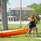 Admiral Farragut Academy waterfront girls walking with kayak