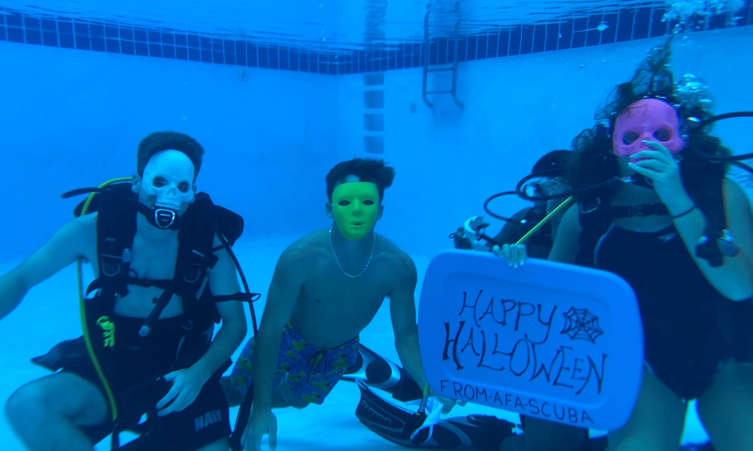 Mrs. Tonya Singleton’s Upper School students shared Happy Halloween messages with masks and skeletons while scuba diving in Farragut’s pool.