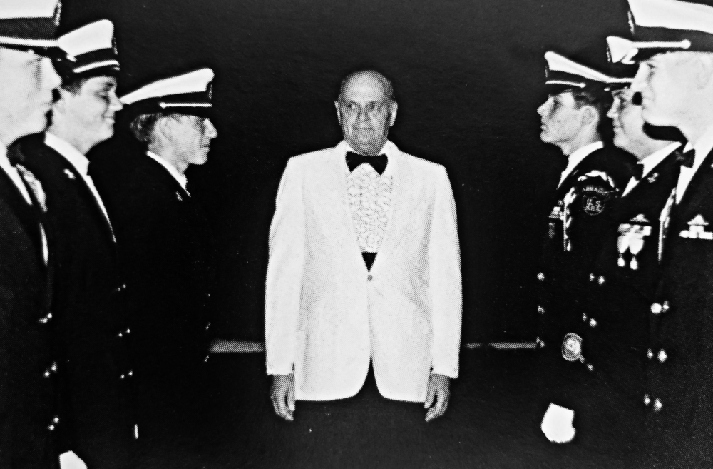 CAPT Orie T. Banks, the Dean of Students at the southern campus from 1953-1987, oversees cadets at a school dance.